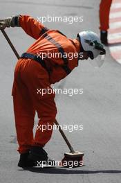 24.05.2007 Monte Carlo, Monaco,  A marshall sweeps away debris - Formula 1 World Championship, Rd 5, Monaco Grand Prix, Thursday