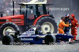 10.11.2007 Marshalls stop Michael Schumacher getting to Damon Hill after they collided during the race at Silverstone, 1995 - Michael Schumacher Story
