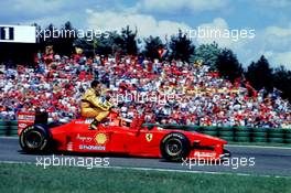 10.11.2007 1997, Michael Schumacher gives Giancarlo Fisichella a lift back to the pitlane - Michael Schumacher Story