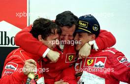 10.11.2007 Michael Schumacher on the podium at the 1997 Argentinian Grand Prix with Jean Todt - Michael Schumacher Story