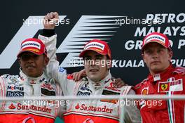 08.04.2007 Kuala Lumpur, Malaysia,  2nd place Lewis Hamilton (GBR), McLaren Mercedes with 1st place Fernando Alonso (ESP), McLaren Mercedes and 3rd place Kimi Raikkonen (FIN), Räikkönen, Scuderia Ferrari - Formula 1 World Championship, Rd 2, Malaysian Grand Prix, Sunday Podium