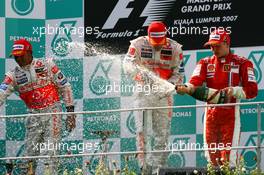 08.04.2007 Kuala Lumpur, Malaysia,  Winner, Fernando Alonso (ESP), McLaren Mercedes, MP4-22, 2nd, Lewis Hamilton (GBR), McLaren Mercedes, MP4-22 and Kimi Raikkonen (FIN), Räikkönen, Scuderia Ferrari, F2007 - Formula 1 World Championship, Rd 2, Malaysian Grand Prix, Sunday Podium