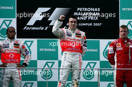 08.04.2007 Kuala Lumpur, Malaysia,  Winner, 1st, Fernando Alonso (ESP), McLaren Mercedes, 2nd, Lewis Hamilton (GBR), McLaren Mercedes, MP4-22 and 3rd, Kimi Raikkonen (FIN), Räikkönen, Scuderia Ferrari, F2007 - Formula 1 World Championship, Rd 2, Malaysian Grand Prix, Sunday Podium