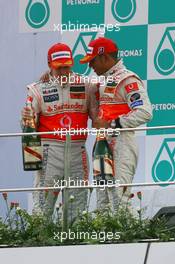 08.04.2007 Kuala Lumpur, Malaysia,  Fernando Alonso (ESP), McLaren Mercedes and Lewis Hamilton (GBR), McLaren Mercedes - Formula 1 World Championship, Rd 2, Malaysian Grand Prix, Sunday Podium