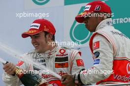 08.04.2007 Kuala Lumpur, Malaysia,  Fernando Alonso (ESP), McLaren Mercedes and Lewis Hamilton (GBR), McLaren Mercedes - Formula 1 World Championship, Rd 2, Malaysian Grand Prix, Sunday Podium