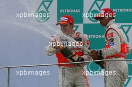 08.04.2007 Kuala Lumpur, Malaysia,  1st place Fernando Alonso (ESP), McLaren Mercedes and 2nd place Lewis Hamilton (GBR), McLaren Mercedes - Formula 1 World Championship, Rd 2, Malaysian Grand Prix, Sunday Podium