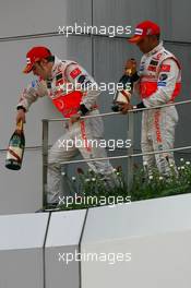 08.04.2007 Kuala Lumpur, Malaysia,  Fernando Alonso (ESP), McLaren Mercedes and Lewis Hamilton (GBR), McLaren Mercedes - Formula 1 World Championship, Rd 2, Malaysian Grand Prix, Sunday Podium