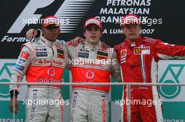 08.04.2007 Kuala Lumpur, Malaysia,  2nd place Lewis Hamilton (GBR), McLaren Mercedes with 1st place Fernando Alonso (ESP), McLaren Mercedes and 3rd place Kimi Raikkonen (FIN), Räikkönen, Scuderia Ferrari - Formula 1 World Championship, Rd 2, Malaysian Grand Prix, Sunday Podium