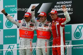 08.04.2007 Kuala Lumpur, Malaysia,  Winner, Fernando Alonso (ESP), McLaren Mercedes, MP4-22, 2nd, Lewis Hamilton (GBR), McLaren Mercedes, MP4-22 and Kimi Raikkonen (FIN), Räikkönen, Scuderia Ferrari, F2007 - Formula 1 World Championship, Rd 2, Malaysian Grand Prix, Sunday Podium