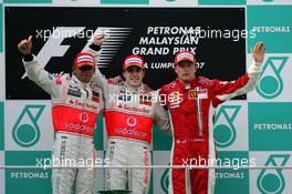 08.04.2007 Kuala Lumpur, Malaysia,  2nd place Lewis Hamilton (GBR), McLaren Mercedes with 1st place Fernando Alonso (ESP), McLaren Mercedes and 3rd place Kimi Raikkonen (FIN), Räikkönen, Scuderia Ferrari - Formula 1 World Championship, Rd 2, Malaysian Grand Prix, Sunday Podium