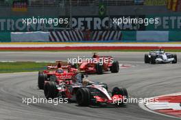 08.04.2007 Kuala Lumpur, Malaysia,  Lewis Hamilton (GBR), McLaren Mercedes, MP4-22 leads Felipe Massa (BRA), Scuderia Ferrari, F2007 - Formula 1 World Championship, Rd 2, Malaysian Grand Prix, Sunday Race