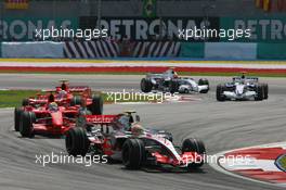 08.04.2007 Kuala Lumpur, Malaysia,  Lewis Hamilton (GBR), McLaren Mercedes, MP4-22 leads Felipe Massa (BRA), Scuderia Ferrari, F2007 - Formula 1 World Championship, Rd 2, Malaysian Grand Prix, Sunday Race