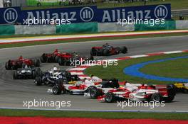 08.04.2007 Kuala Lumpur, Malaysia,  Start, Fernando Alonso (ESP), McLaren Mercedes, MP4-22, Lewis Hamilton (GBR), McLaren Mercedes, MP4-22 and Felipe Massa (BRA), Scuderia Ferrari, F2007 - Formula 1 World Championship, Rd 2, Malaysian Grand Prix, Sunday Race