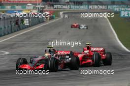 08.04.2007 Kuala Lumpur, Malaysia,  Lewis Hamilton (GBR), McLaren Mercedes, MP4-22 and Kimi Raikkonen (FIN), Räikkönen, Scuderia Ferrari, F2007 - Formula 1 World Championship, Rd 2, Malaysian Grand Prix, Sunday Race