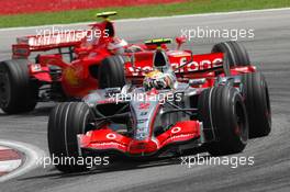 08.04.2007 Kuala Lumpur, Malaysia,  Lewis Hamilton (GBR), McLaren Mercedes, MP4-22 leads Kimi Raikkonen (FIN), Räikkönen, Scuderia Ferrari, F2007 - Formula 1 World Championship, Rd 2, Malaysian Grand Prix, Sunday Race