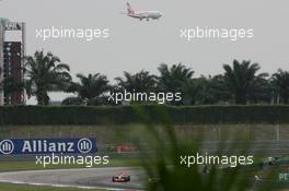 07.04.2007 Kuala Lumpur, Malaysia,  Lewis Hamilton (GBR), McLaren Mercedes, MP4-22 with an Airliner coming into land in the background - Formula 1 World Championship, Rd 2, Malaysian Grand Prix, Saturday Qualifying