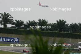 07.04.2007 Kuala Lumpur, Malaysia,  Lewis Hamilton (GBR), McLaren Mercedes, MP4-22 with an Airliner coming into land in the background - Formula 1 World Championship, Rd 2, Malaysian Grand Prix, Saturday Qualifying