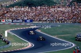 10.11.2007 1986 GP F1 Osterreichring, Ayrton Senna (BRA) Lotus 98T leads Nelson Piquet (BRA), Williams FW15 - Ayrton Senna Story