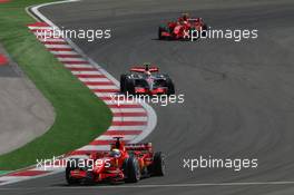 26.08.2007 Istanbul, Turkey,  Felipe Massa (BRA), Scuderia Ferrari, F2007, Lewis Hamilton (GBR), McLaren Mercedes, MP4-22 and Kimi Raikkonen (FIN), Räikkönen, Scuderia Ferrari, F2007 - Formula 1 World Championship, Rd 12, Turkish Grand Prix, Sunday Race