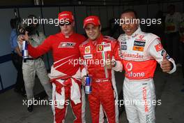 25.08.2007 Istanbul, Turkey,  Kimi Raikkonen (FIN), Räikkönen, Scuderia Ferrari with pole position sitter Felipe Massa (BRA), Scuderia Ferrari and Lewis Hamilton (GBR), McLaren Mercedes - Formula 1 World Championship, Rd 12, Turkish Grand Prix, Saturday Qualifying