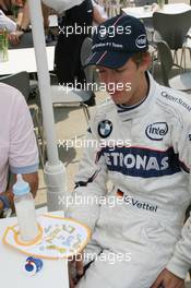 17.06.2007 Indianapolis, USA,  Sebastian Vettel (GER), Test Driver, BMW Sauber F1 Team, is presented a bib saying "A Star is born" and a dummy - Formula 1 World Championship, Rd 7, United States Grand Prix, Sunday Podium