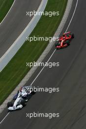 17.06.2007 Indianapolis, USA,  Nick Heidfeld (GER), BMW Sauber F1 Team, F1.07 leads Kimi Raikkonen (FIN), Räikkönen, Scuderia Ferrari, F2007 - Formula 1 World Championship, Rd 7, United States Grand Prix, Sunday Race