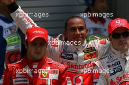 16.06.2007 Indianapolis, USA,  Felipe Massa (BRA), Scuderia Ferrari with Lewis Hamilton (GBR), McLaren Mercedes gets pole position and Fernando Alonso (ESP), McLaren Mercedes - Formula 1 World Championship, Rd 7, United States Grand Prix, Saturday Qualifying