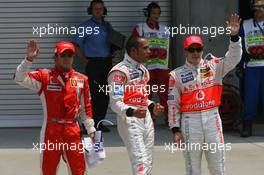 16.06.2007 Indianapolis, USA,  Felipe Massa (BRA), Scuderia Ferrari with Lewis Hamilton (GBR), McLaren Mercedes who gets pole position and Fernando Alonso (ESP), McLaren Mercedes - Formula 1 World Championship, Rd 7, United States Grand Prix, Saturday Qualifying