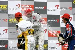 02.09.2007 Nürburg, Germany,  Podium, Romain Grosjean (FRA), ASM Formula 3, Portrait (2nd, left) and Sébastien Buemi (SUI), ASL Mücke Motorsport, Portrait (3rd, right), give Harald Schlegelmilch (LVA), HS Technik, Portrait (1st, center), a champaign shower - F3 Euro Series 2007 at Nürburgring