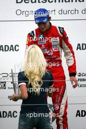 02.09.2007 Nürburg, Germany,  Hiltja Müller (GER), Miss Germany International, presents Marco Wittmann (GER), Josef Kaufmann Racing, Portrait, with the winners trophy - Formula BMW Germany Championship 2007, Round 13 & 14, Nürburgring, 2nd Race - For further information and more images please register at www.formulabmw-images.com - This image is free for editorial use only. Please use for Copyright/Credit: c BMW AG