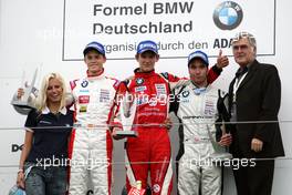 02.09.2007 Nürburg, Germany,  (middle) 1st Marco Wittmann (GER), Josef Kaufmann Racing; (left) 2nd Daniel Campos (ESP), Eifelland Racing; (far left) Hiltja Müller (GER), Miss Northern Germany; (right) 3rd Philipp Eng (AUT), ASL-Mücke Motorsport; (far right) VIP/ sponsor. - Formula BMW Germany Championship 2007, Round 13 & 14, Nürburgring, 2nd Race - For further information and more images please register at www.formulabmw-images.com - This image is free for editorial use only. Please use for Copyright/Credit: c BMW AG