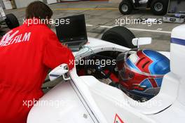 31.08.2007 Nürburg, Germany,  Engineer checks the computer data from the car in between qualifying sessions - Formula BMW Germany Championship 2007, Round 13 & 14, Nürburgring, Qualifying - For further information and more images please register at www.formulabmw-images.com - This image is free for editorial use only. Please use for Copyright/Credit: c BMW AG