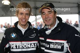 06.07.2007 Silverstone, England,  Nigel Mansell (GBR) and Sebastian Vettel (GER), Test Driver, BMW Sauber F1 Team - BMW Pitlane Park at the British Grand Prix - For further information and more images please register at www.formulabmw-images.com - This image is free for editorial use only. Please use for Copyright/Credit: c BMW AG