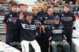 06.07.2007 Silverstone, England,  Nigel Mansell (GBR) and Sebastian Vettel (GER), Test Driver, BMW Sauber F1 Team with Formula BMW Drivers - BMW Pitlane Park at the British Grand Prix - For further information and more images please register at www.formulabmw-images.com - This image is free for editorial use only. Please use for Copyright/Credit: c BMW AG