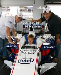 08.07.2007 Silverstone, England,  England Rugby Internationals Mike Tindall (GBR) and Andy Beattie (GBR) visit the BMW Sauber F1 Team Pit Lane Park and meet Sebastian Vettel (GER), Test Driver, BMW Sauber F1 Team ahead of todays British Grand Prix - BMW Pitlane Park at the British Grand Prix - For further information and more images please register at www.formulabmw-images.com - This image is free for editorial use only. Please use for Copyright/Credit: c BMW AG