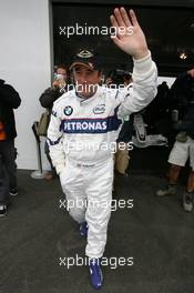 06.07.2007 Silverstone, England,  Nigel Mansell (GBR), Thrills the Silverstone crowds at the wheel of the BMW Sauber F1 Team car within the BMW Sauber F1 Team Pitlane Park - BMW Pitlane Park at the British Grand Prix - For further information and more images please register at www.formulabmw-images.com - This image is free for editorial use only. Please use for Copyright/Credit: c BMW AG