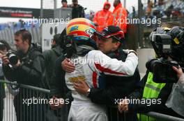 05.10.2008 Zandvoort, The Netherlands,  Olivier Panis (FRA), Seat Holder of A1 Team France congratulates Loic Duval (FRA), driver of A1 Team France - A1GP World Cup of Motorsport 2008/09, Round 1, Zandvoort, Sunday Race 2 - Copyright A1GP - Free for editorial usage