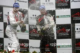 05.10.2008 Zandvoort, The Netherlands,  Podium, Loic Duval (FRA), driver of A1 Team France (1st, left) and Earl Bamber (NZL), driver of A1 Team New Zealand (3rd, right), spraying champaign - A1GP World Cup of Motorsport 2008/09, Round 1, Zandvoort, Sunday Race 2 - Copyright A1GP - Free for editorial usage