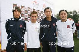 06.11.2008 Chengdu, China,  Li Tie (CHN) ex Everton football player now current Chengdu Blades player with Filipe Albuquerque (POR), driver of A1 Team Portugal at the Chengdu Blades training ground for a friendly football match - A1GP World Cup of Motorsport 2008/09, Round 2, Chengdu, Thursday - Copyright A1GP - Free for editorial usage