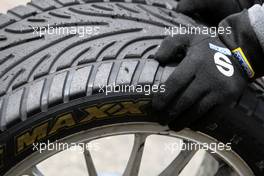 11.04.2008 Hockenheim, Germany,  Dunlop Sport Maxx tyre held by mechanic - DTM 2008 at Hockenheimring