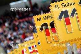 13.04.2008 Hockenheim, Germany,  The signs of the gridgirls were in the style of the new sponsor Deutsche Post: they were shapes like stamps! - DTM 2008 at Hockenheimring
