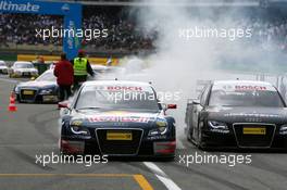 13.04.2008 Hockenheim, Germany,  Race winner Mattias Ekström (SWE), Audi Sport Team Abt Sportsline, Audi A4 DTM, smoking his tyres when driving into the parc ferme together with Timo Scheider (GER), Audi Sport Team Abt, Audi A4 DTM (2nd) and Tom Kristensen (DNK), Audi Sport Team Abt, Audi A4 DTM (3rd) - DTM 2008 at Hockenheimring