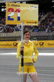 13.04.2008 Hockenheim, Germany,  The signs of the gridgirls were in the style of the new sponsor Deutsche Post: they were shapes like stamps! Also the board of Christijan Albers (NED), TME, Audi A4 DTM was at the grid. - DTM 2008 at Hockenheimring