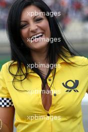 13.04.2008 Hockenheim, Germany,  Deutsche Post gridgirl buttoned up her shirt... - DTM 2008 at Hockenheimring