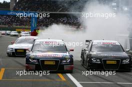 13.04.2008 Hockenheim, Germany,  Race winner Mattias Ekström (SWE), Audi Sport Team Abt Sportsline, Audi A4 DTM, smoking his tyres when driving into the parc ferme together with Timo Scheider (GER), Audi Sport Team Abt, Audi A4 DTM (2nd) and Tom Kristensen (DNK), Audi Sport Team Abt, Audi A4 DTM (3rd) - DTM 2008 at Hockenheimring