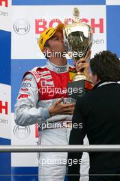 13.04.2008 Hockenheim, Germany,  Podium, Timo Scheider (GER), Audi Sport Team Abt, Portrait (2nd), kisses his trophy - DTM 2008 at Hockenheimring