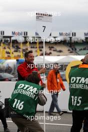13.04.2008 Hockenheim, Germany,  Former DTM driver Christian Abt (GER) competes in the Porsche Carrera Cup 2008 now. As a joke former collegue Timo Scheider (GER), Audi Sport Team Abt, Audi A4 DTM waited him up on the starting grid with the position board. - DTM 2008 at Hockenheimring