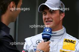 17.05.2008 Klettwitz, Germany,  Ralf Schumacher (GER), Mücke Motorsport AMG Mercedes, Portrait, being interviewed for German TV - DTM 2008 at Lausitzring