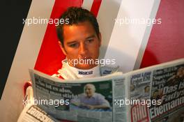 17.05.2008 Klettwitz, Germany,  Timo Scheider (GER), Audi Sport Team Abt, Portrait, reading the paper - DTM 2008 at Lausitzring