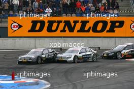 18.05.2008 Klettwitz, Germany,  Start of the race, with Paul di Resta (GBR), Team HWA AMG Mercedes, AMG Mercedes C-Klasse. leading Bruno Spengler (CDN), Team HWA AMG Mercedes, AMG Mercedes C-Klasse and Timo Scheider (GER), Audi Sport Team Abt, Audi A4 DTM, into the first corner - DTM 2008 at Lausitzring